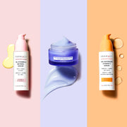 Three products next to each other, 1% Vitamin A Retinol Serum, 10% Niacinamide Night Mask, and 10% Waterless Vitamin C Serum on a tri color background