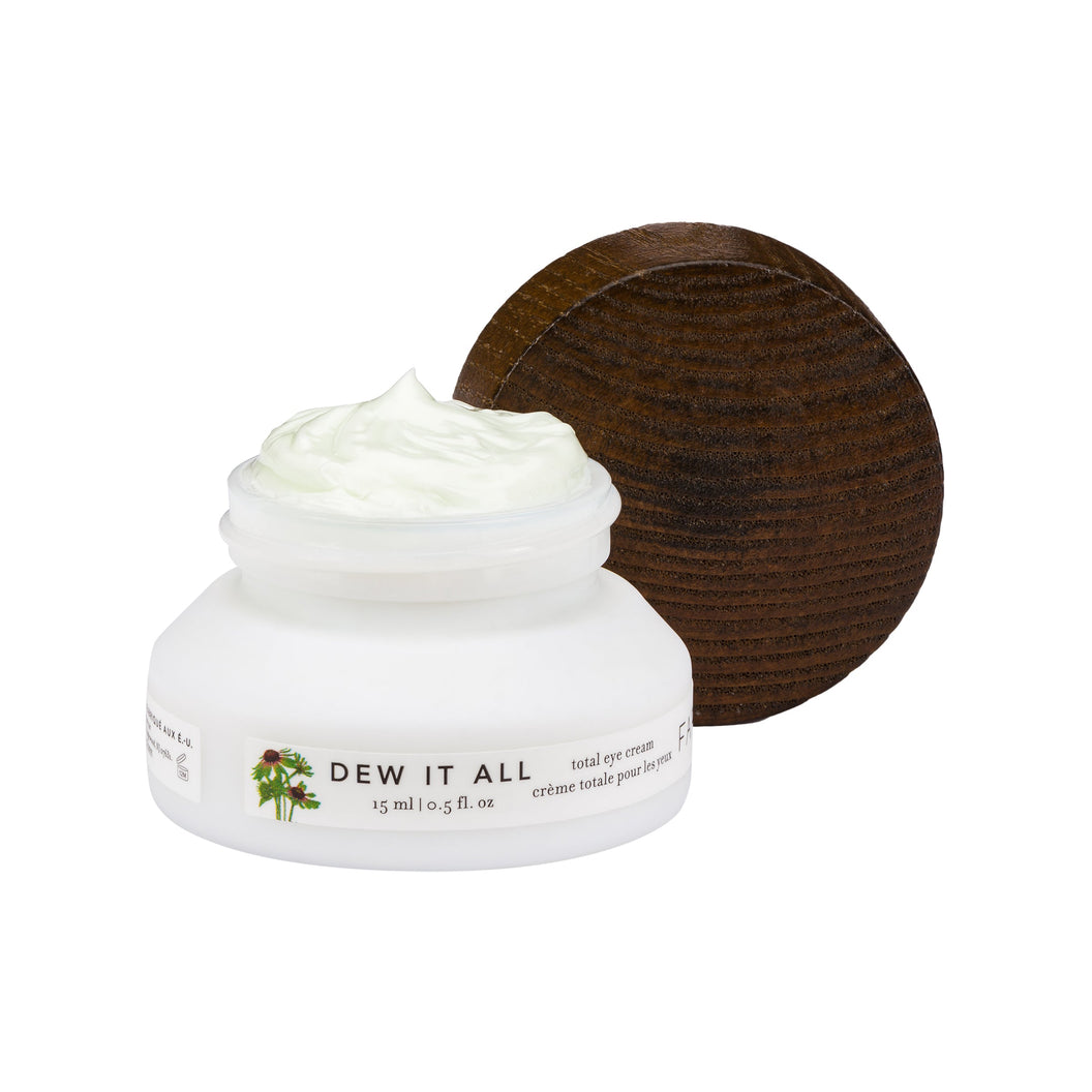 An open bottle of Farmacy's Dew it all eye cream