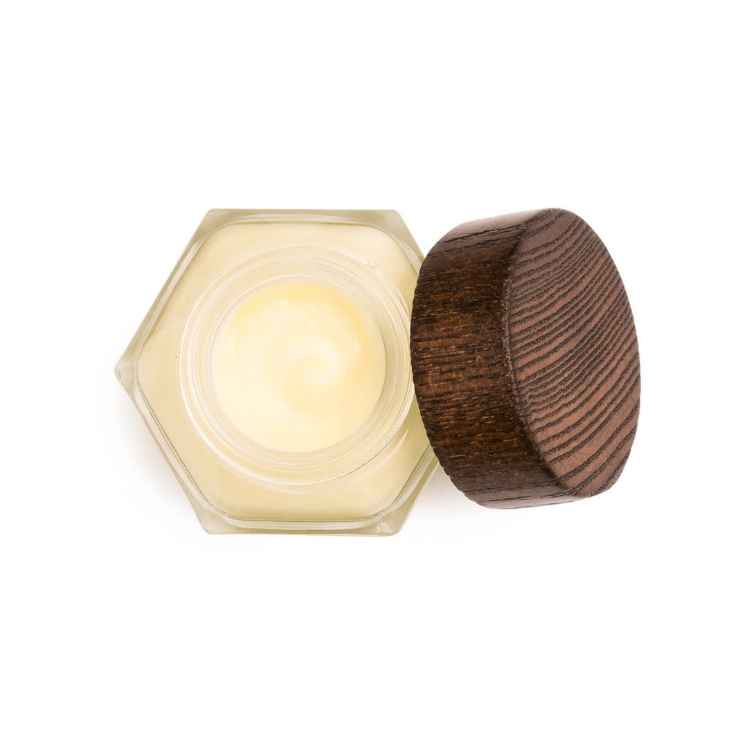 An aerial view of an open bottle of Farmacy's Honey Drop antioxidant-rich honey face moisturizer